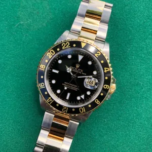 1997 Rolex GMT MASTER II 16713 Steel Gold Oyster Two Tone Black Wristwatch Box Papers