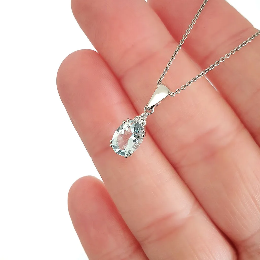 Elegant Oval Cut Aquamarine and Trilogy Diamond Pendant