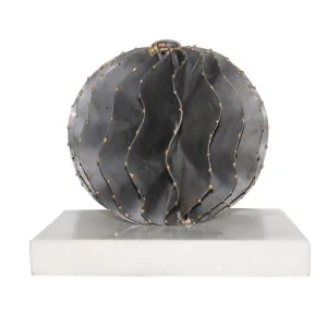 IRON ORB ON WHITE MARBLE