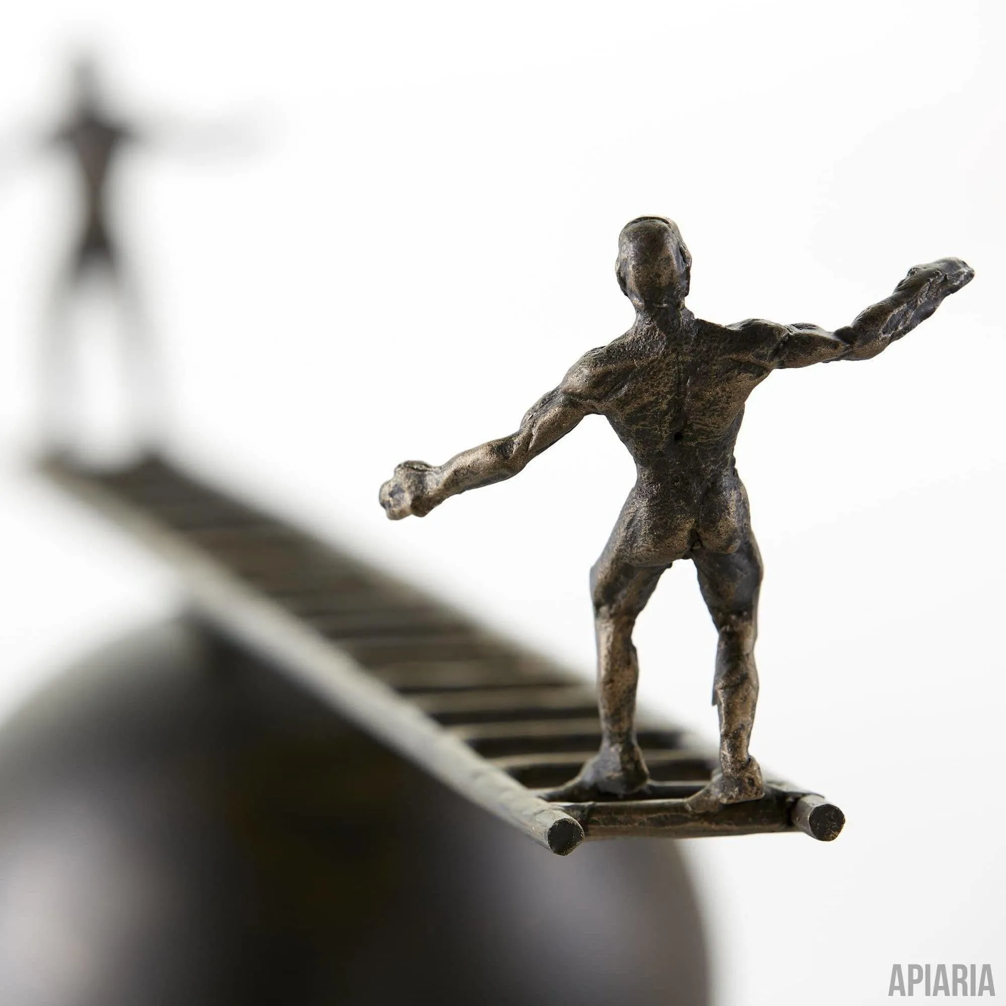 Teetering Humans Sculpture