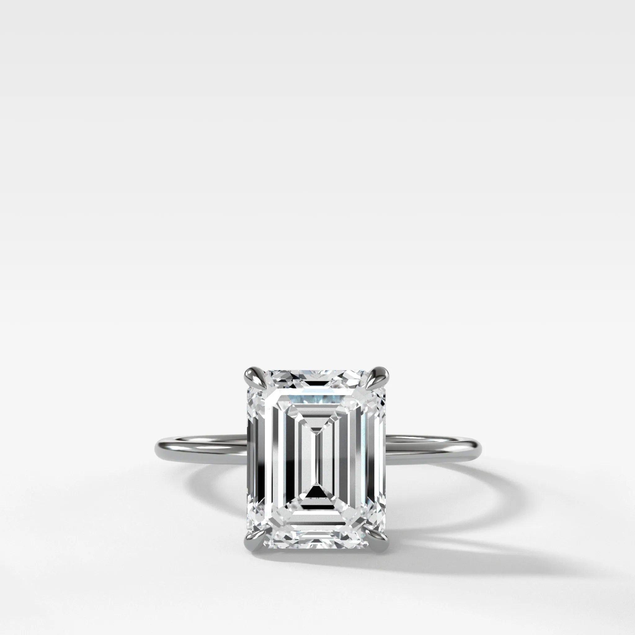 Thin   Simple Solitaire Engagement Ring With North South Emerald Cut Diamond