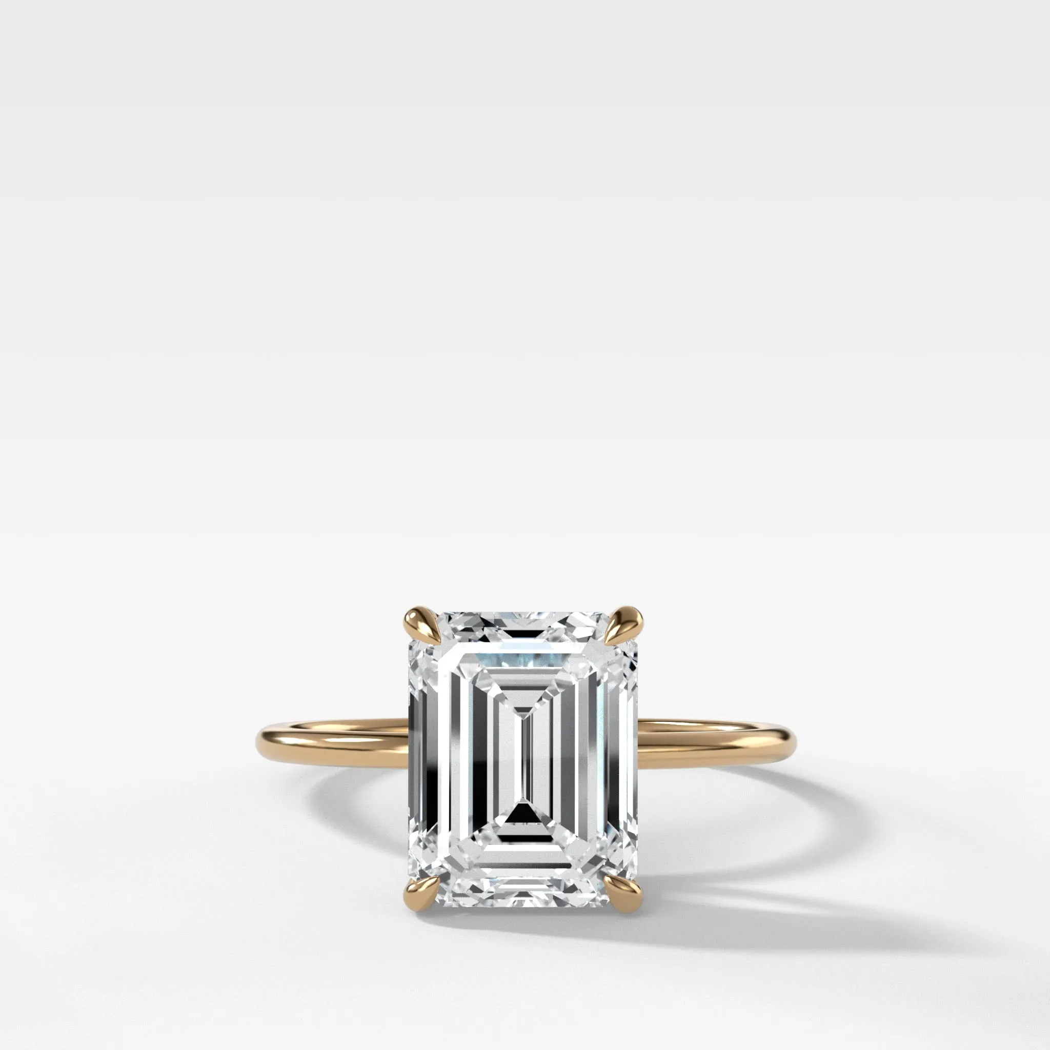 Thin   Simple Solitaire Engagement Ring With North South Emerald Cut Diamond