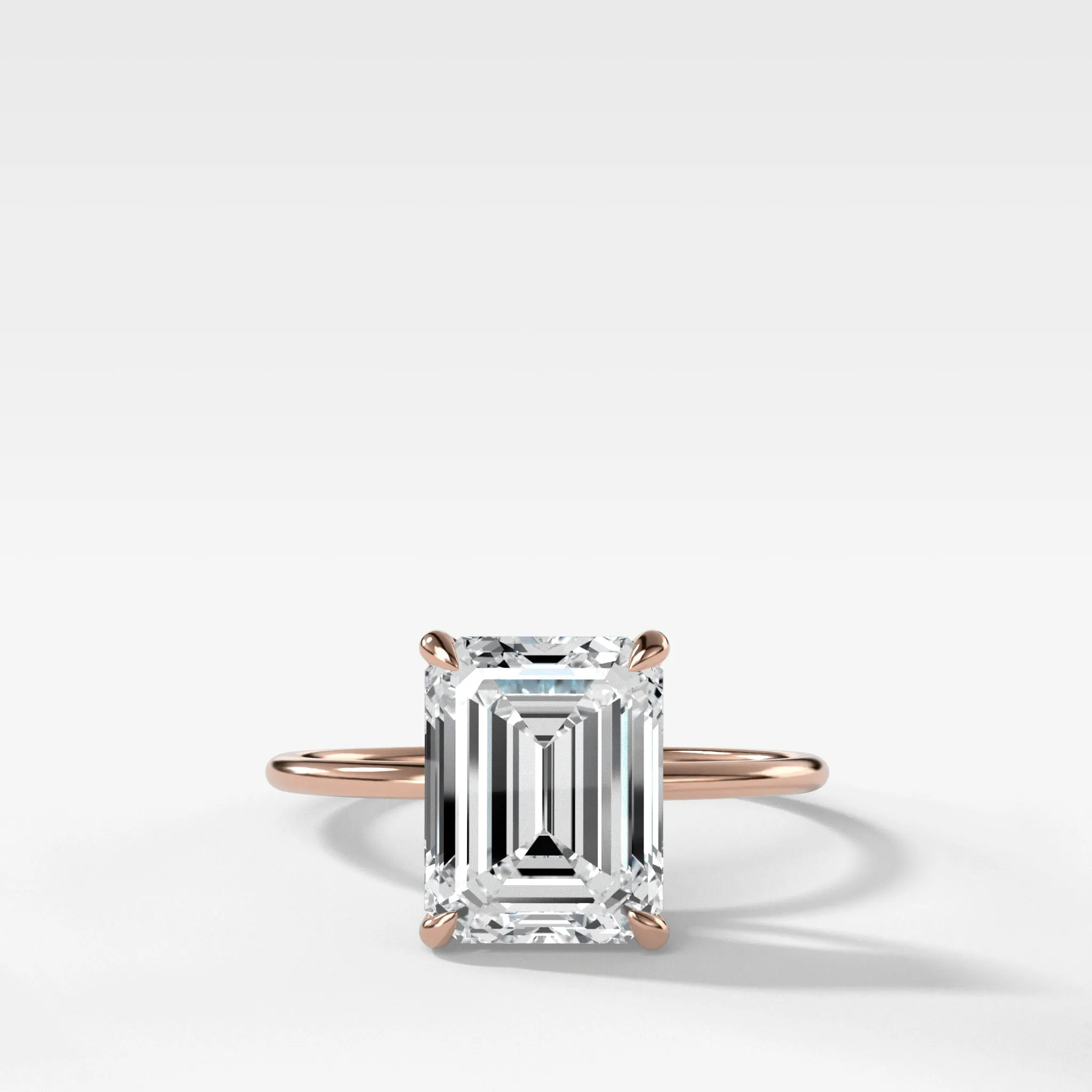Thin   Simple Solitaire Engagement Ring With North South Emerald Cut Diamond