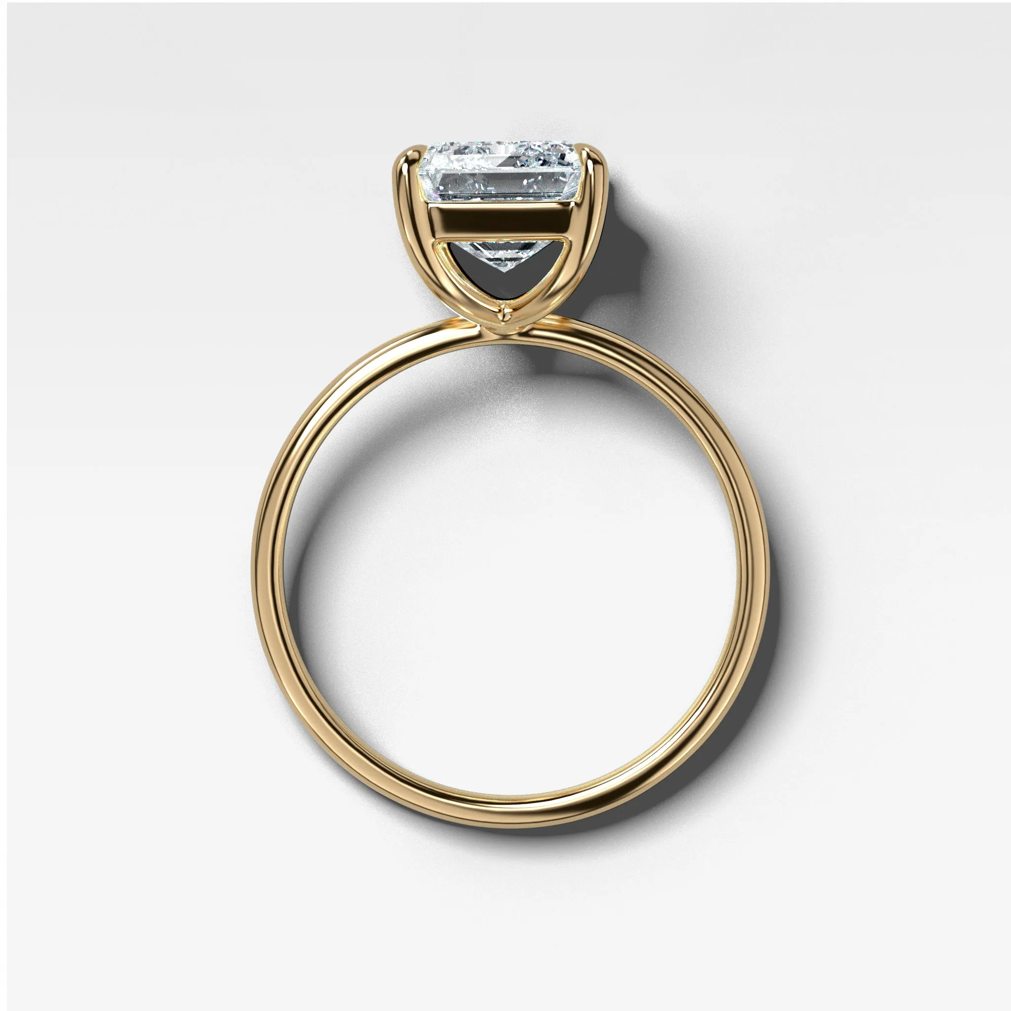 Thin   Simple Solitaire Engagement Ring With North South Emerald Cut Diamond